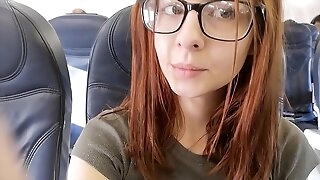 Cute pornstar fingers herself in airplane bathroom